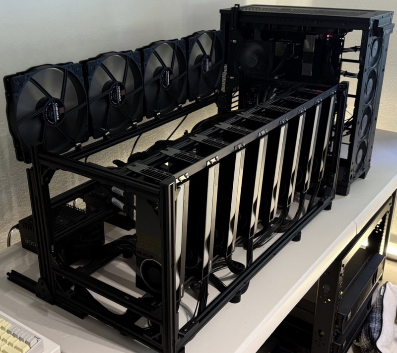 Eight NVIDIA RTX PRO 6000 cards on an open frame with a dedicated fan wall
