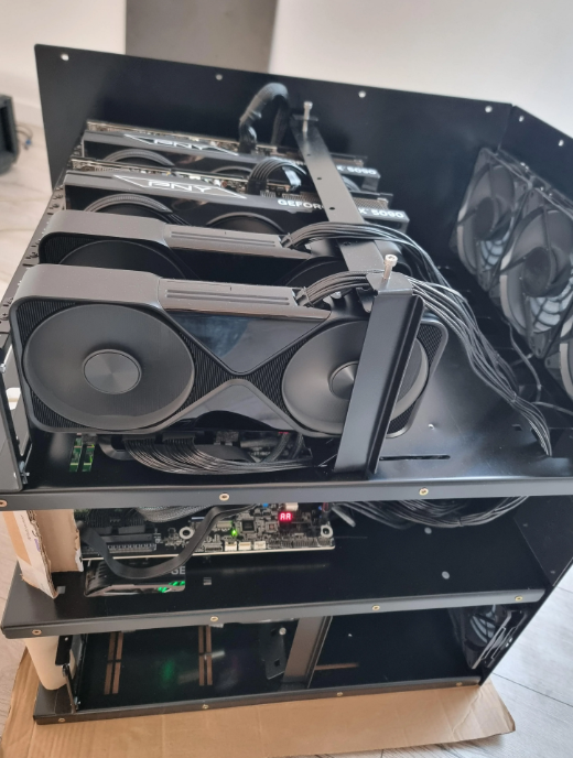 PNY GeForce RTX 5090 cards in a multi-tier open-frame build with a fan wall